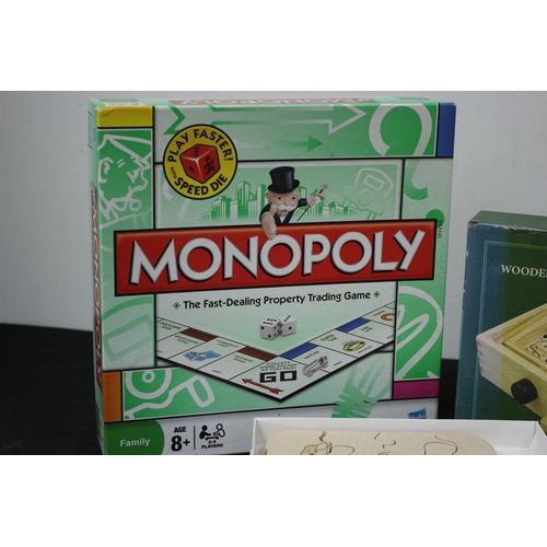 290 - Monopoly and 2 Wooden Puzzle Games