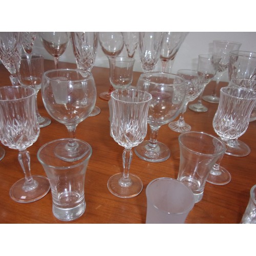 45 - A Large Selection of Glasses Including Wine, Shot Glasses and Lots More