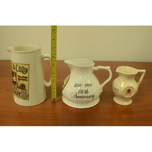 46 - Whiskey & Ale Pitchers with Advertising on them