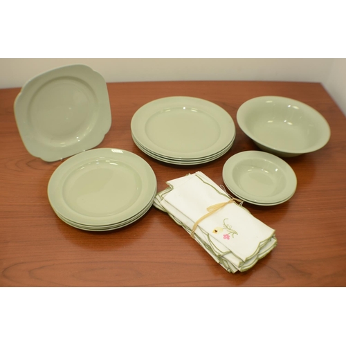 520 - A Selection of green Plates and Material Napkins