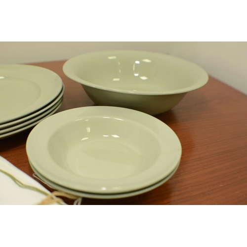 520 - A Selection of green Plates and Material Napkins