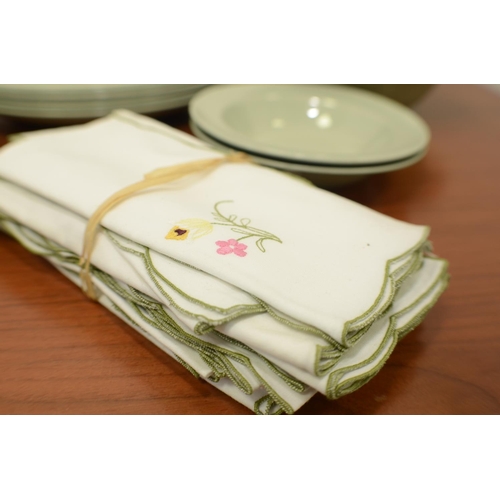 520 - A Selection of green Plates and Material Napkins