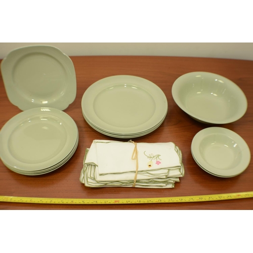 520 - A Selection of green Plates and Material Napkins