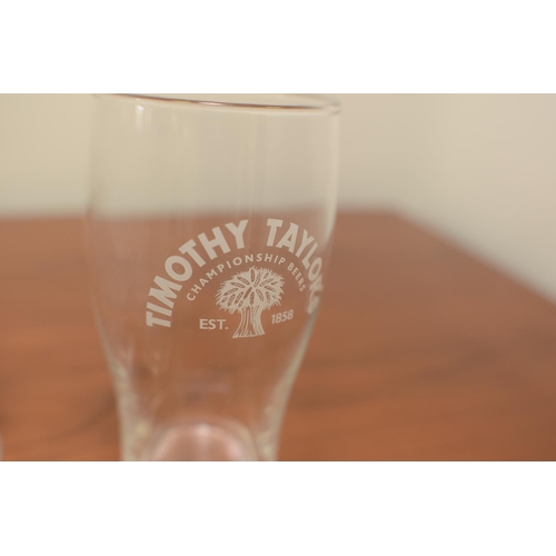 528 - 4 Guinness pint glasses, 1 Timothy Taylor pint glass and 6 glasses