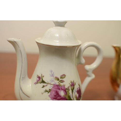 531 - Foreign Teapot, milk jug, sugar bowl plus 3 other Tea-Pots