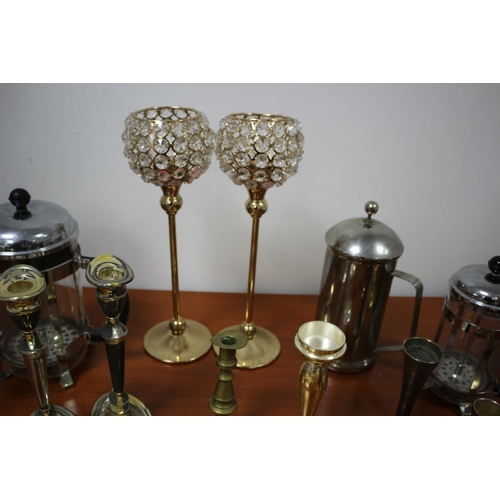 471 - A large selection of plate and metal ware including cafeterias, candle sticks and candelabra and can... 