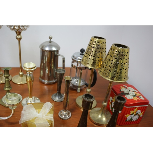 471 - A large selection of plate and metal ware including cafeterias, candle sticks and candelabra and can... 