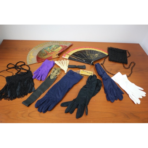 473 - A large selection of vintage ladies gloves, belt, bags fans and hair curlers