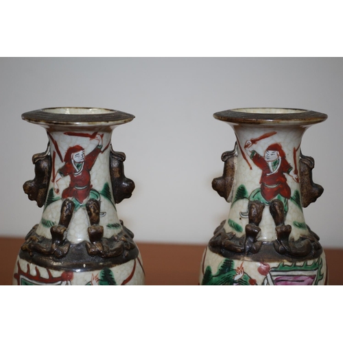 502 - Pair of believed to be antique Chinese Hand-painted crackled glaze warrior vases