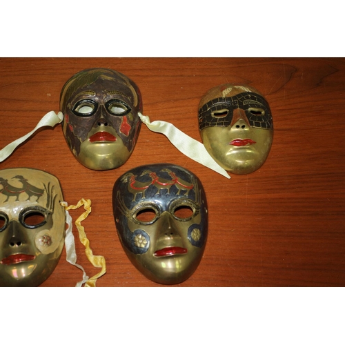 556 - 5 brass Venetian Style Masks, hand painted.