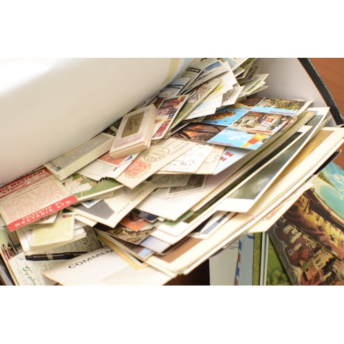 329 - A Box of Stamps, Post Cards aged and 2 Trade Card Catalogues