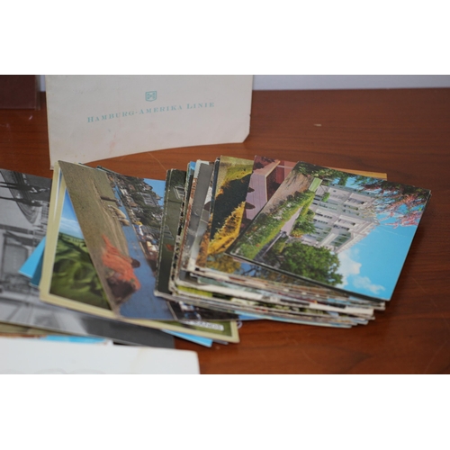 209 - A collection of postcards.