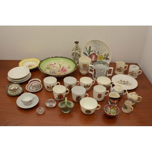 379 - A large selection of plates, cups and other items.