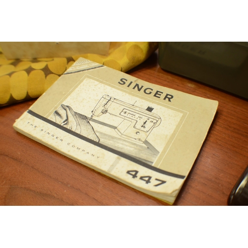 415 - Vintage Singer Sewing Machine model 447 with handbook and foot pedal - Working