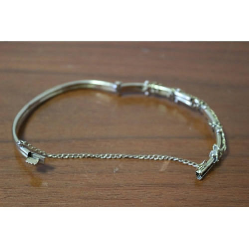 259 - Presented as 9k Gold Hollow Bangle with Safety Chain