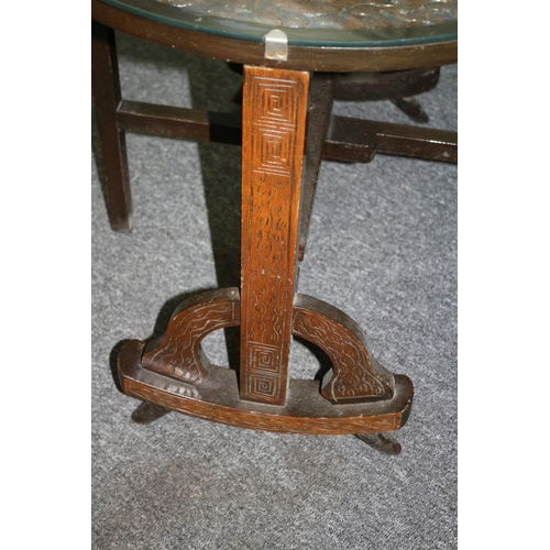 480 - Oriental highly decorative glass tilt top table with ornate wooden stand