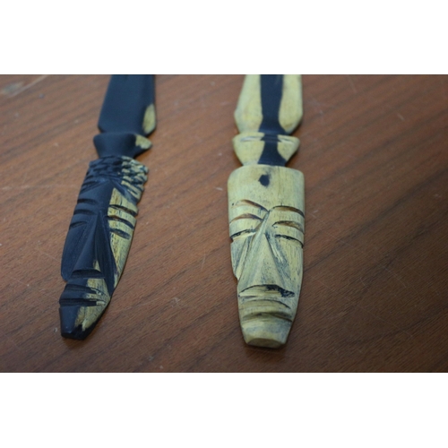 387 - Pair of Light and Dark Wood African Hand Carved Blades with Mask Handles