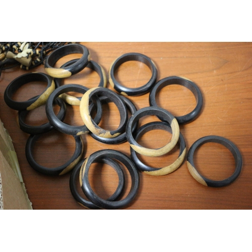 388 - Large Quantity of Quality Hand Made Wooden Bangles, Necklaces and Bracelets in a Box