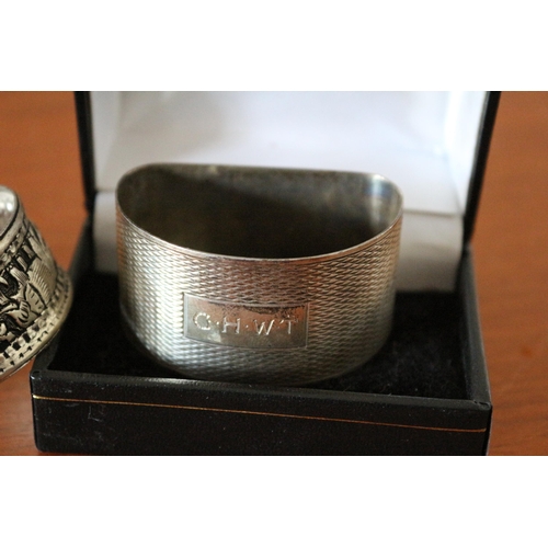 49 - Silver Hallmarked Napkin Ring - 19.2g plus an Indian Design White Metal Napkin Ring