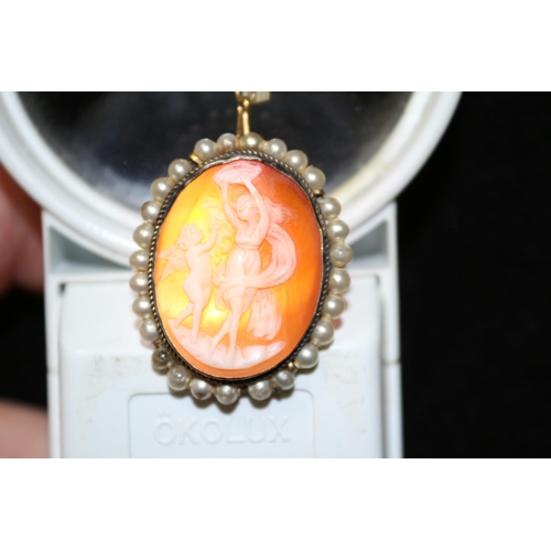 70 - Tested as Silver Setting with Well Carved Cameo Inset and Pearl Surround on Safety Chain and Pin