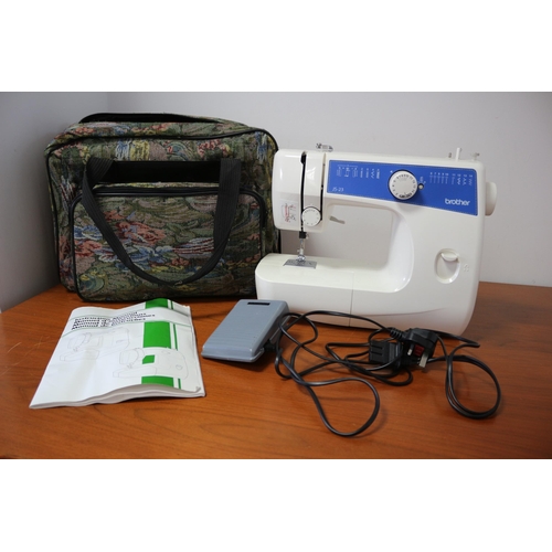 196 - Brother Sewing Machine - JS23 Model - Fully Working with Manual and Bobbin Reels - In a Zipped Case