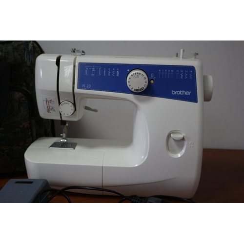 196 - Brother Sewing Machine - JS23 Model - Fully Working with Manual and Bobbin Reels - In a Zipped Case