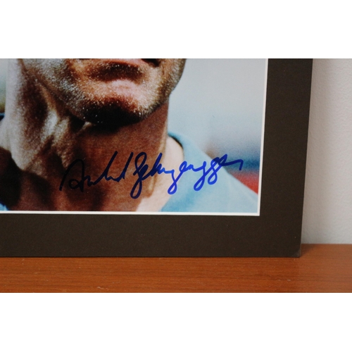 214 - Mounted Autographed Photo of Arnold Schwarzenegger with Certificate of Authenticity