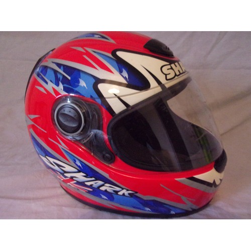 114 - A Used Carl Fogarty motogp crash helmet with dust bag