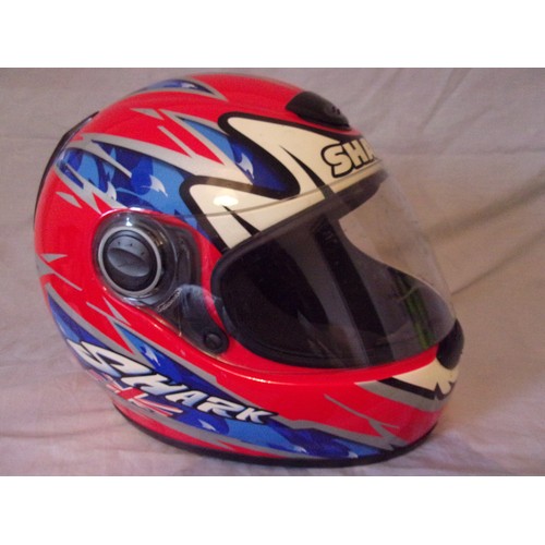 114 - A Used Carl Fogarty motogp crash helmet with dust bag