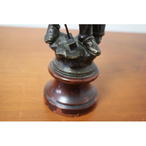 105 - Spelter/ Metal Blacksmith on Wooden Base 39cm