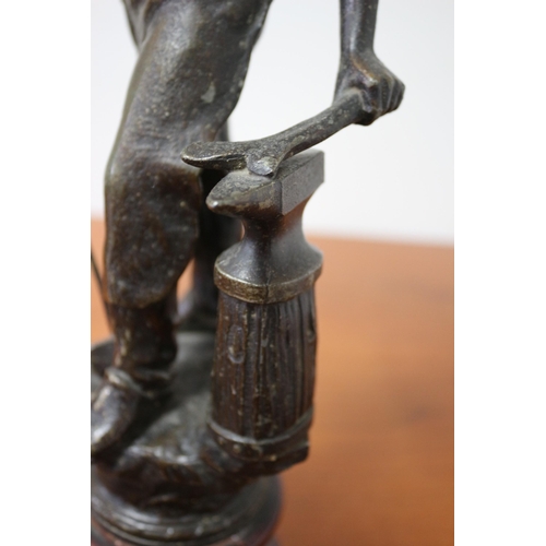 105 - Spelter/ Metal Blacksmith on Wooden Base 39cm