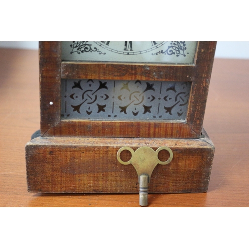 175 - Vintage Wooden cased Mantle Clock with Decorative Glass Front plus Pendulum and Key - 26 x 17cm