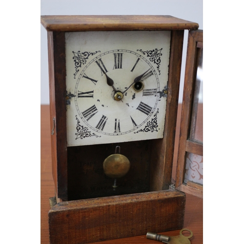 175 - Vintage Wooden cased Mantle Clock with Decorative Glass Front plus Pendulum and Key - 26 x 17cm