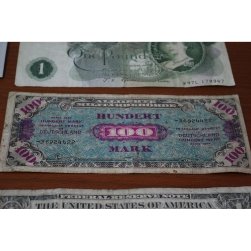 41 - 10 Shilling Note, 2 x £1 notes plus Foreign notes of age