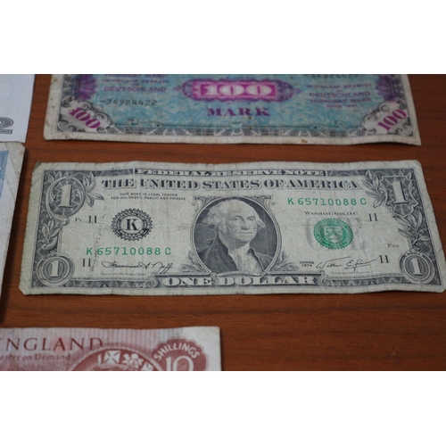 41 - 10 Shilling Note, 2 x £1 notes plus Foreign notes of age