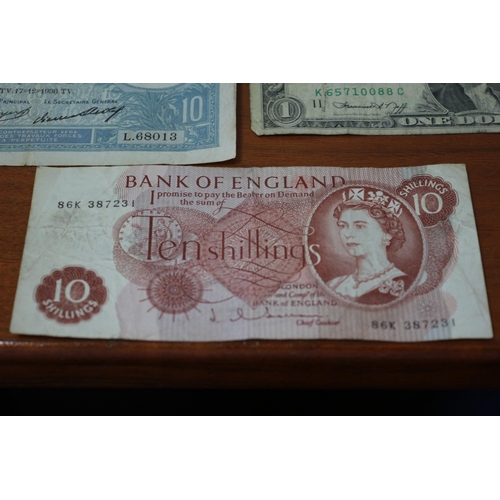 41 - 10 Shilling Note, 2 x £1 notes plus Foreign notes of age