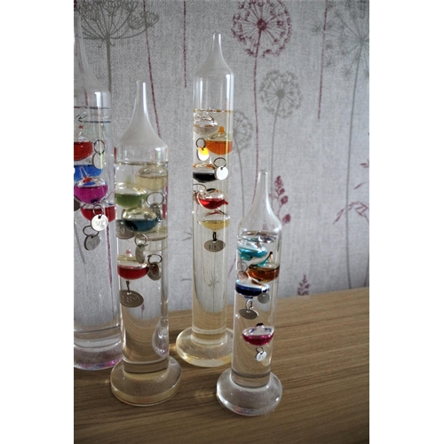 227 - 4 x Decorative Glass Galileo Thermometer 
Tallest is 29cm High