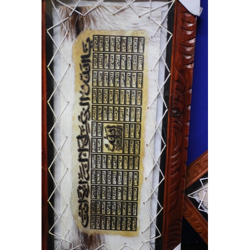 74 - Wood frame with Cow Hide enclosed which has Arabic Writing x 2