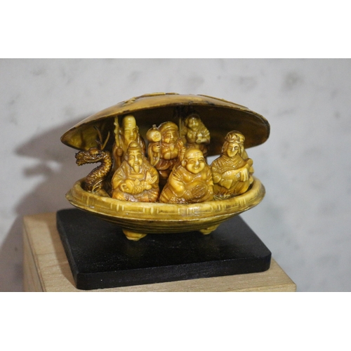 22 - Chinese Boxed Carved Clam Shell with Dragon Boat Carrying Buddha and Various Deities