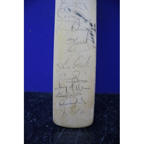 145 - Miniature Multi Signed Cricket Bat