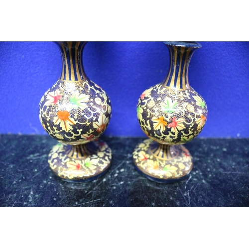 146 - Pair of Highly Decorated Candlesticks with Floral Design - 15.5cm Tall