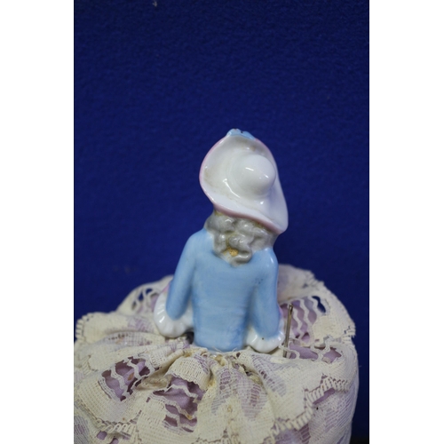 213 - Aged Porcelain Pin Doll with Cushion - 14.5cm