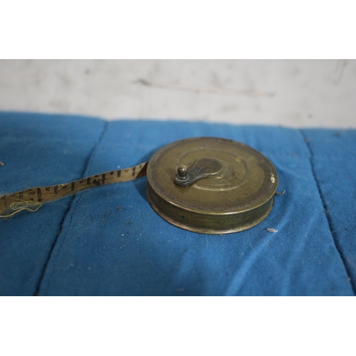 148 - Vintage Brass Wind Up Tape Measure - 18ft - 5cm Dia