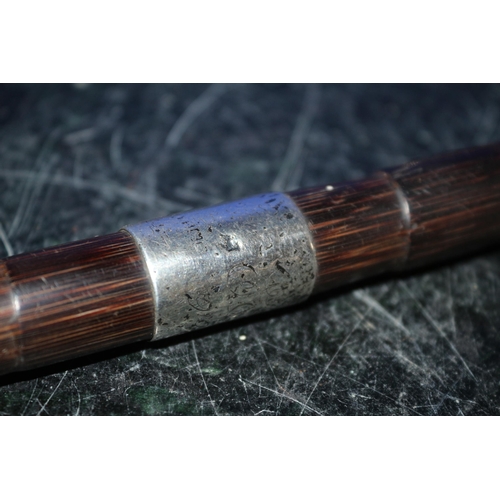 59 - A Silver Hallmarked Topped and Ringed Walking Cane in Bamboo