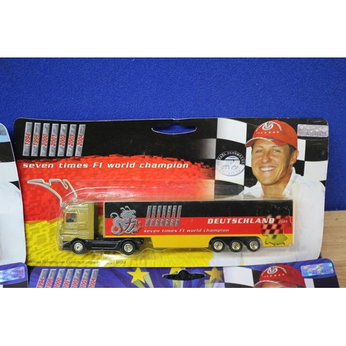 47 - 4 x Michael Schumacher Lorries in Card Backed Packaging