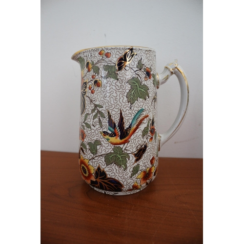 390 - Believed to be a Vintage Keeling & Co Pair of Highly Decorative Jugs with Bird and Floral Design