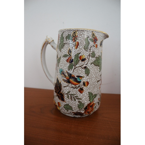 390 - Believed to be a Vintage Keeling & Co Pair of Highly Decorative Jugs with Bird and Floral Design