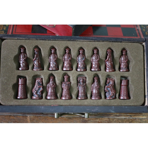 556 - Chinese Resin Chess Pieces Housed in an Ornate Twin Drawer Lacquered Chess Box - 28 x 27cm