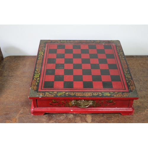 556 - Chinese Resin Chess Pieces Housed in an Ornate Twin Drawer Lacquered Chess Box - 28 x 27cm