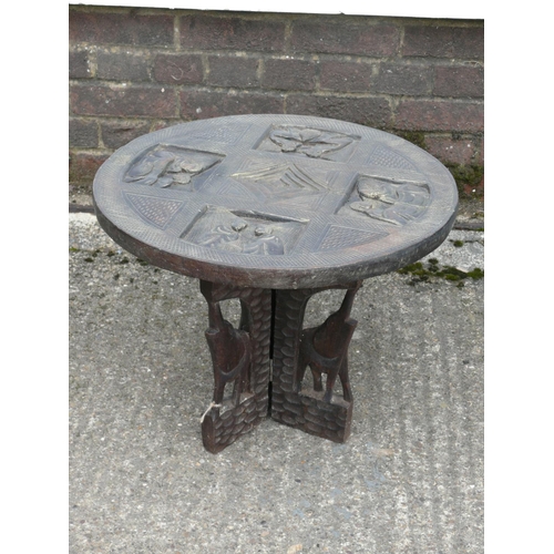 89 - Carved table with elephants, 53cm diameter x 42cm height